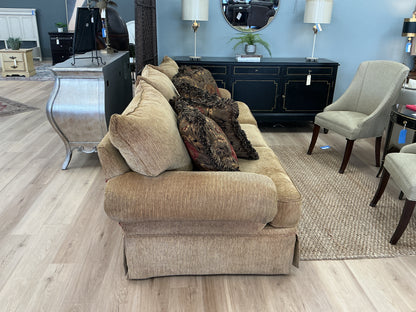 Gold Toned Skirted Sofa w/ 5 Accent Pillows