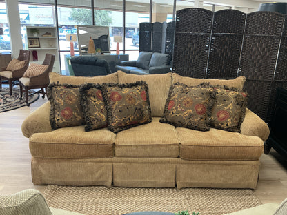 Gold Toned Skirted Sofa w/ 5 Accent Pillows