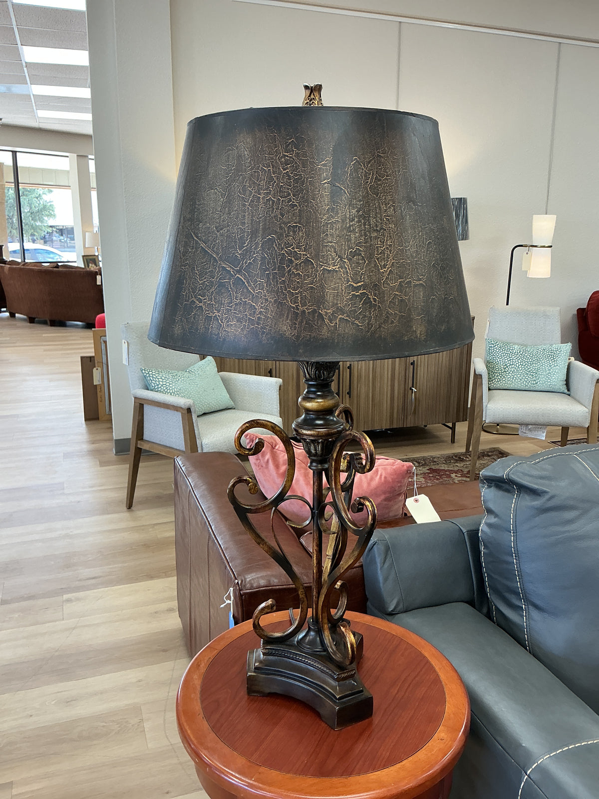 Bronze Scrollwork Base Paired With A Dark Crackled Shade